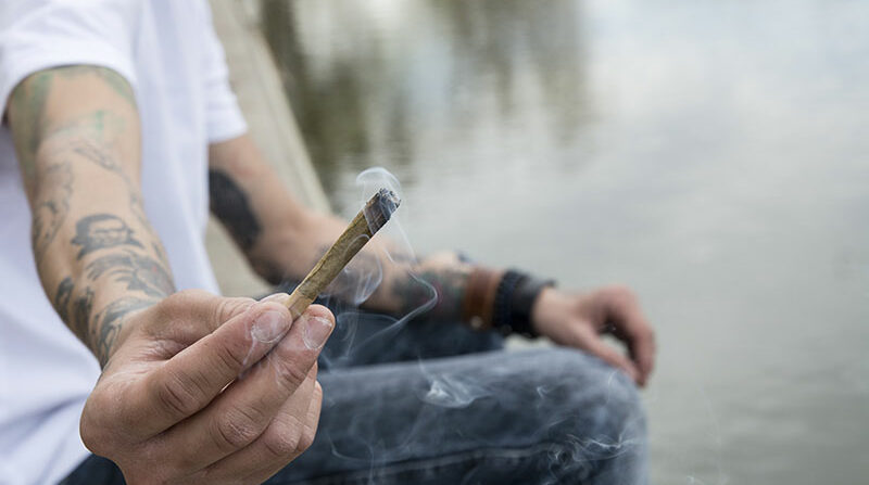 Man passing a joint