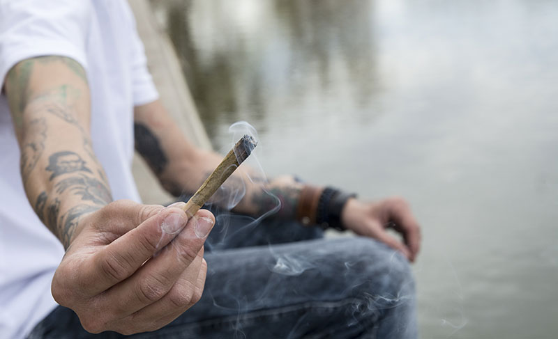Man passing a joint