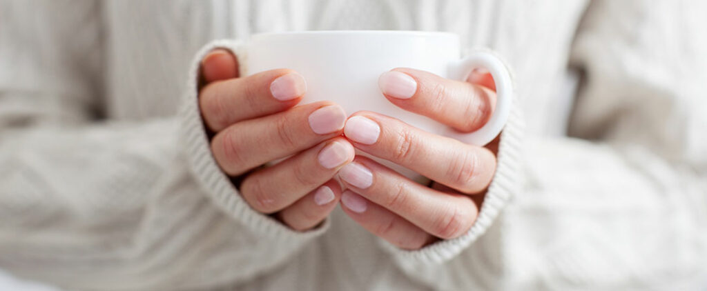 Holding a cup of tea