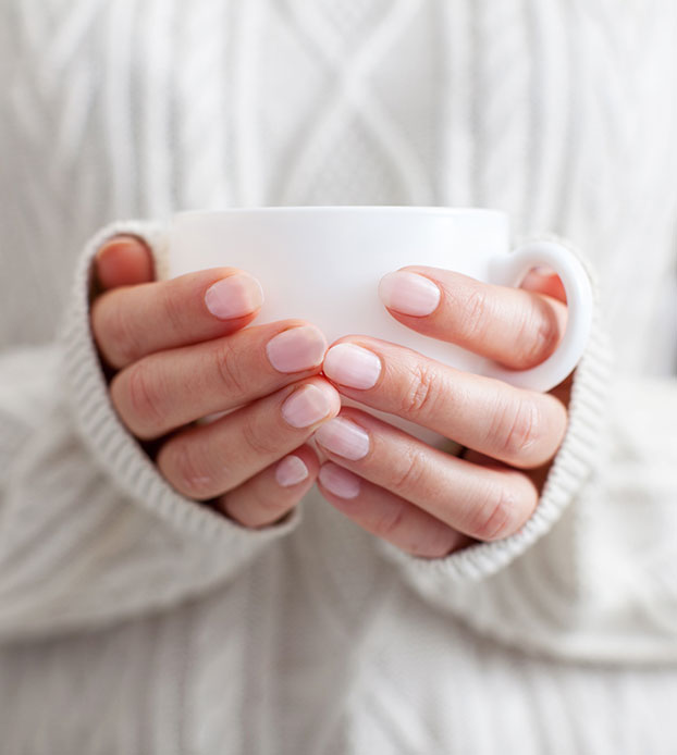Holding a cup of tea