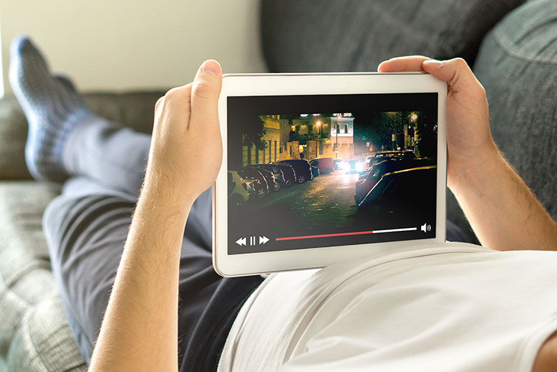 Watching a movie on a tablet
