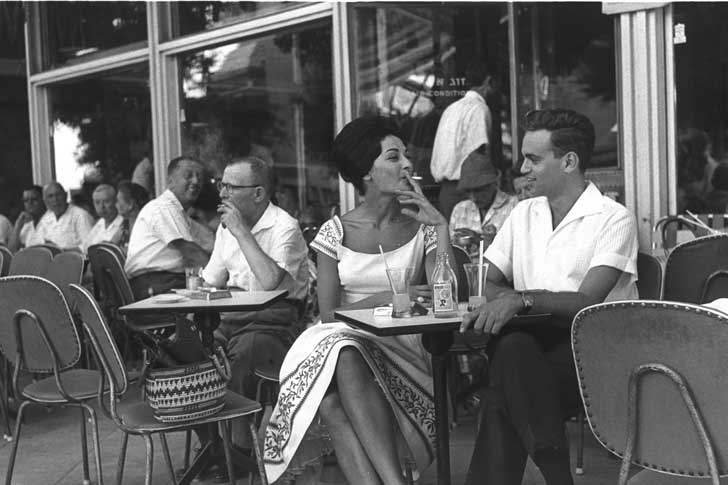 Israelis smoking at a sidewalk cafe in Tel Aviv