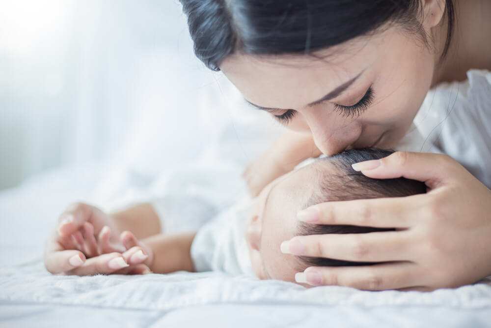 mother sleeping baby