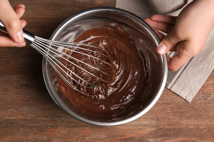 Whisking chocolate cake dough