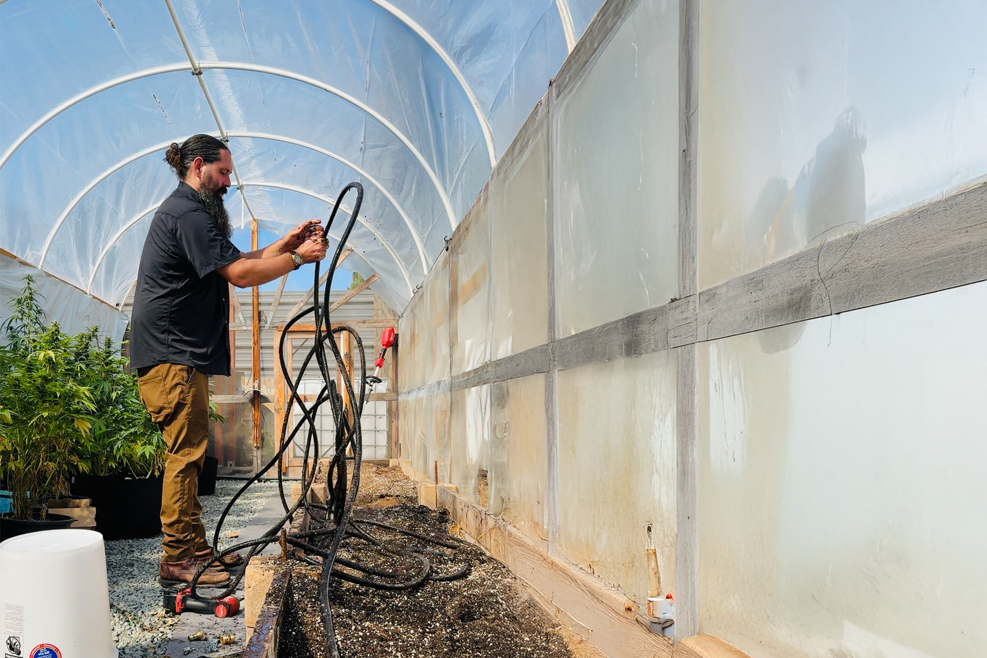 Proper outdoor growing gear helps manage irrigation, plant health, and changing weather conditions.
